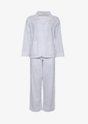 Hvid nattøjssæt med marineblå prikker, langærmet skjorte og bukser.
