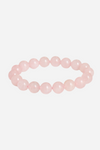 Armbånd af runde rosa kvartsperler, ensartet i størrelse, med lys pink og blank overflade.