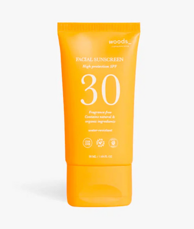 Orange tube solcreme fra WOODS, SPF 30, vegansk, 50ml, til ansigtet.