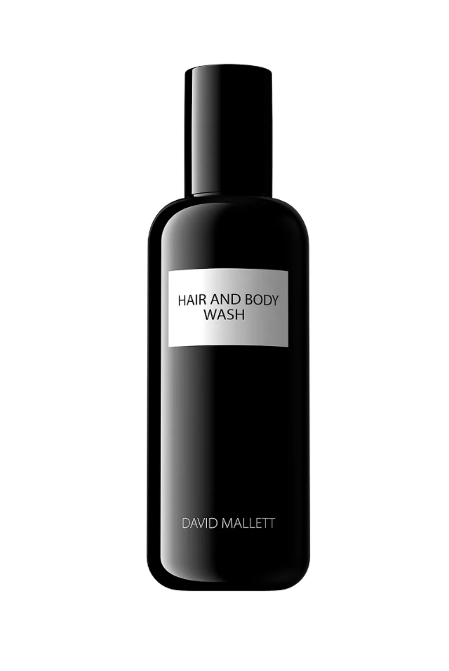 Sort flaske med minimalistisk design, mærket "HAIR AND BODY WASH" af David Mallett, 250ml.