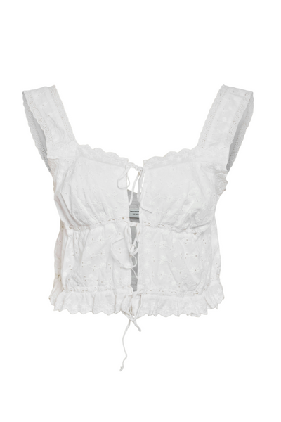Hvid cropped top med broderi anglaise, brede stropper og bindesløjfer foran.